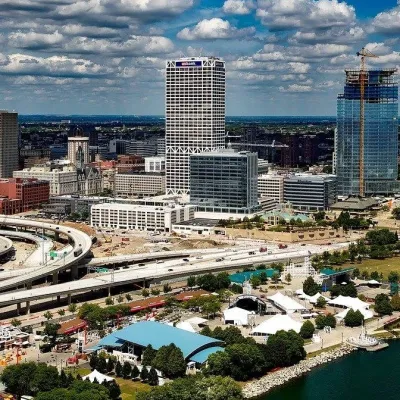 a large body of water with a city in the background